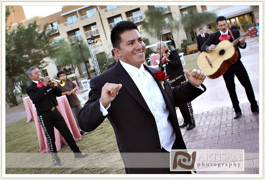 groom dancing with the mariachi band
