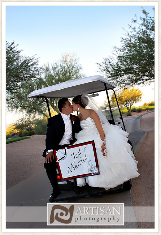 bride and groom on golf cart and just married sign